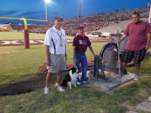 Faculty ringing the bell
